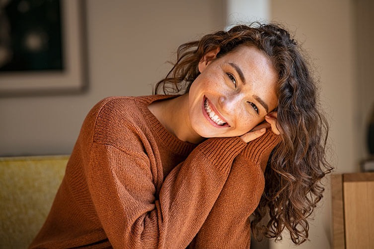 Woman Smiling on Couch